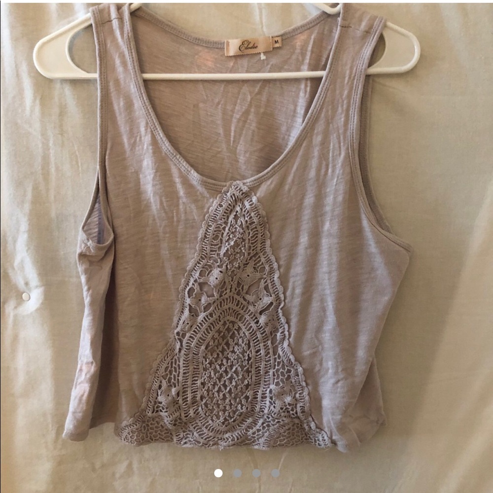 Grey tank top with stitching pattern on front.